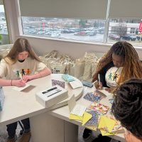 Children in non for profit writing letters